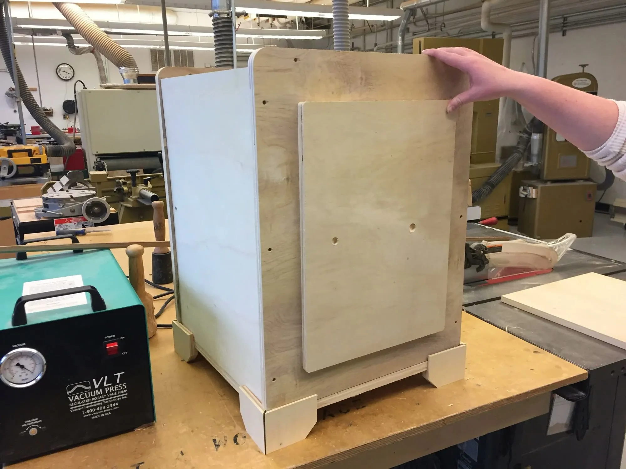 The CNC-routed plywood housing being assembled in the shop